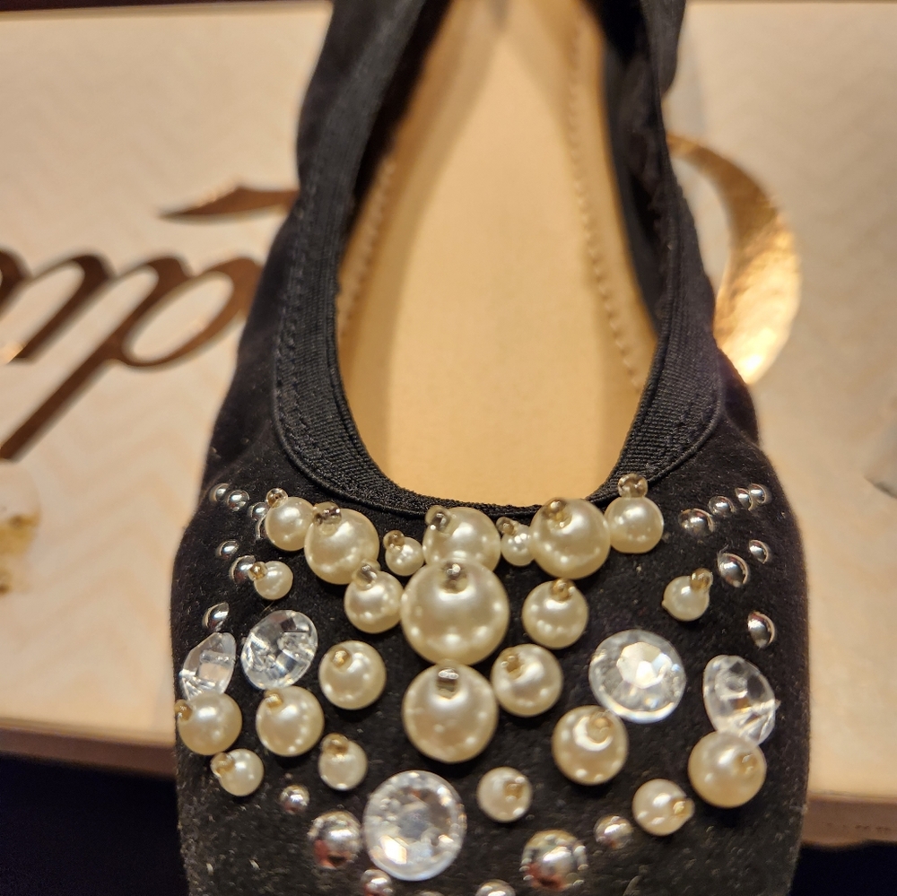 Black flats with small pearls in front